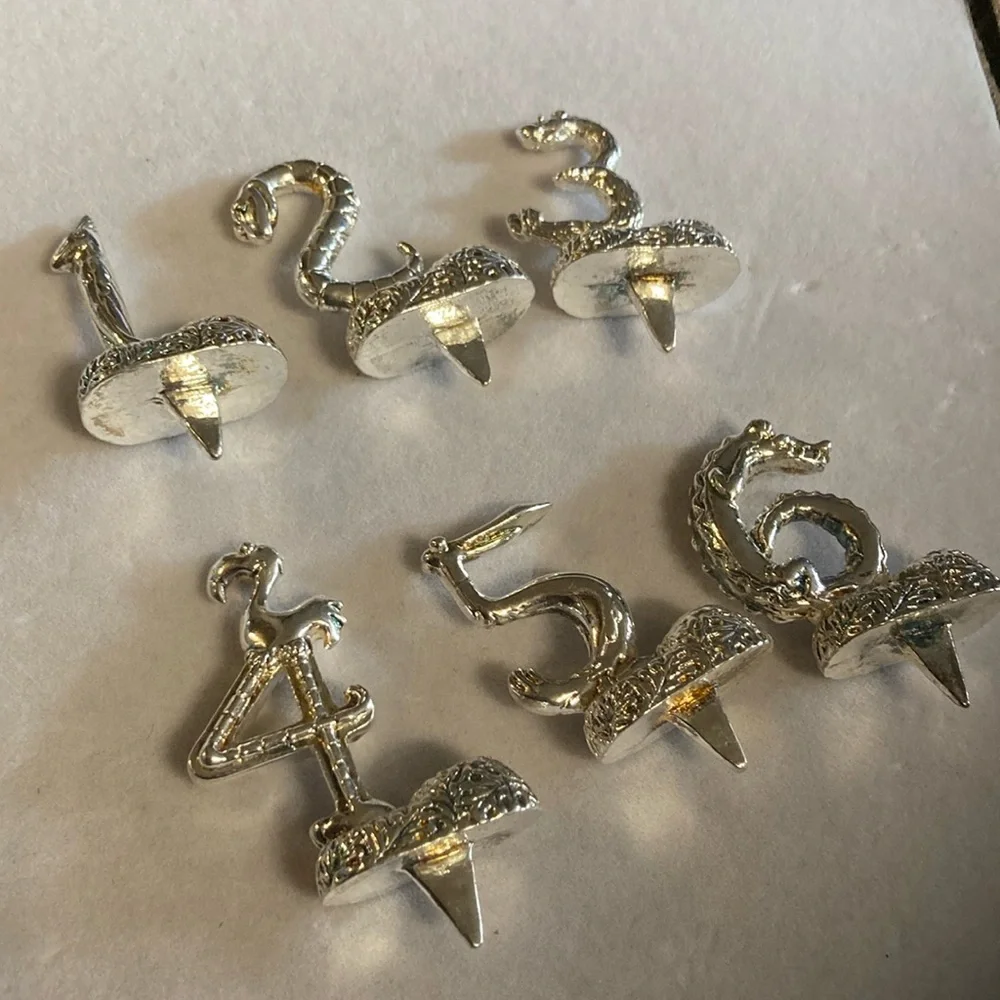 Silver tone animal birthday markers holds candle in each one . 1-6 . Pre owned
